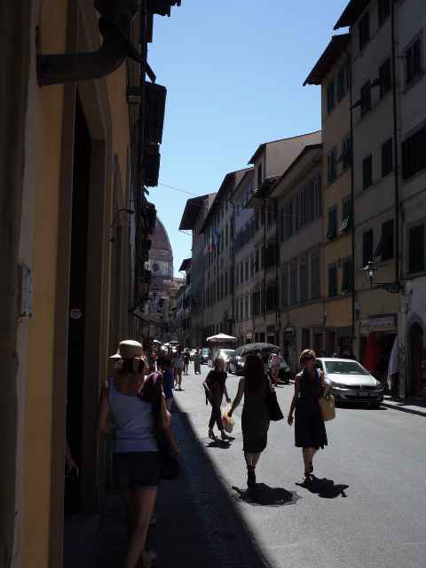 people in the streets around the duomo in summer