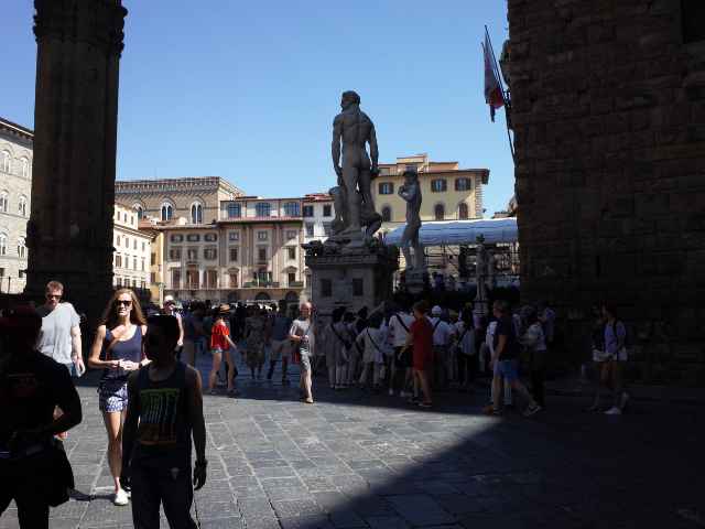 palazzo signoria in summer full of people