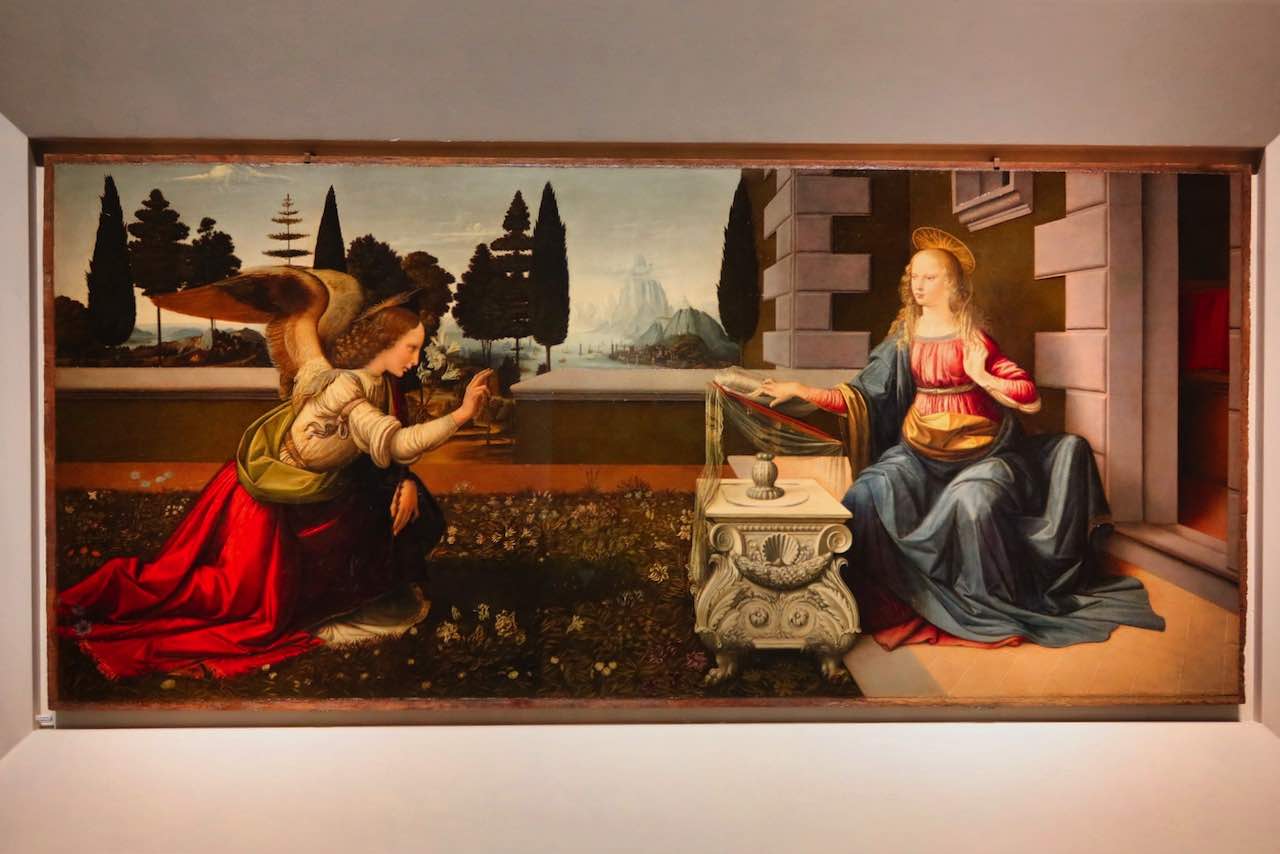 Painting Annunciation by Verrocchio and Leonardo Da Vinci in the Uffizi Gallery