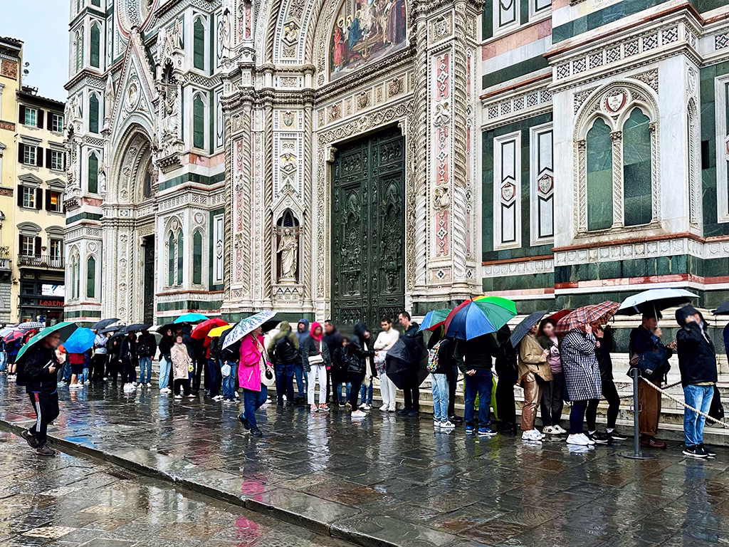 People Queuing For the Duomo in the Rain