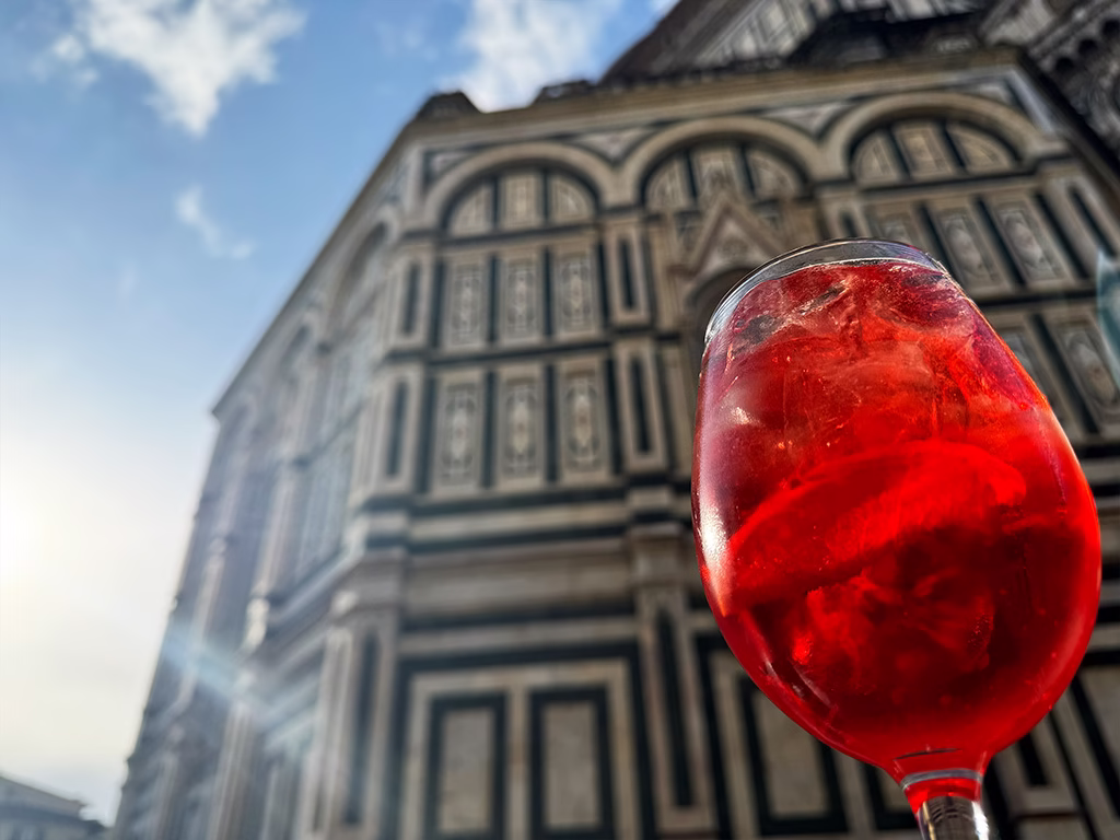 campari spritz with duomo behind
