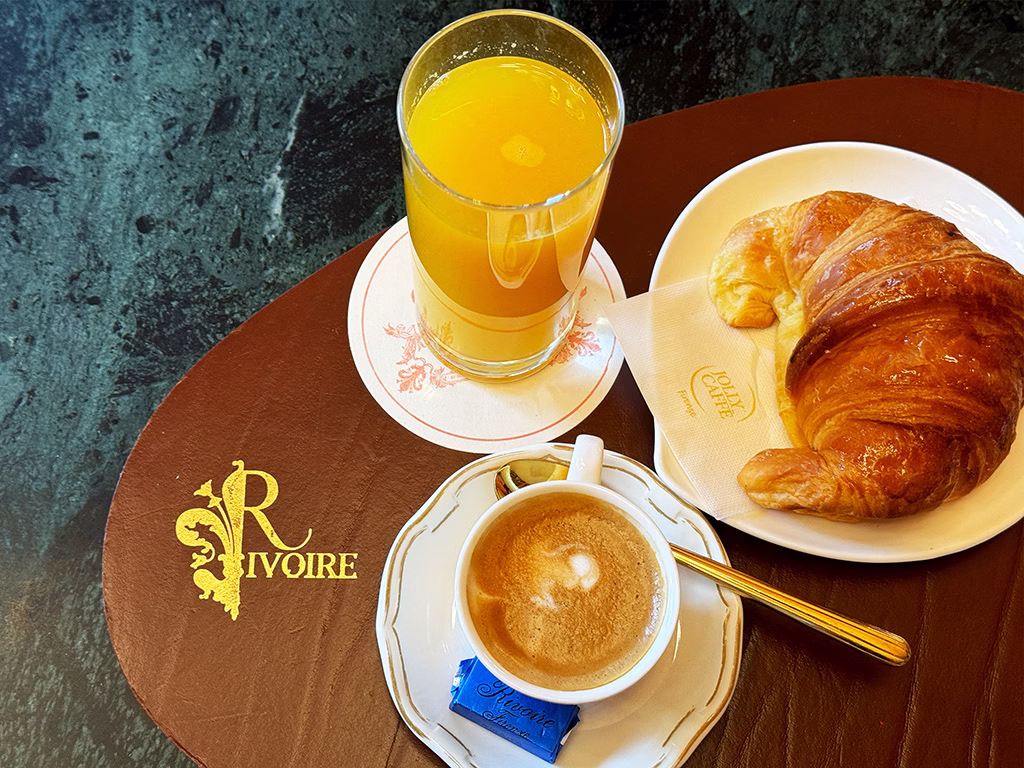 Rivoire Breakfast Table with juice coffee and croissant